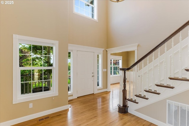 980 SW 7th St, Dundee, OR 97115 - entryway featuring a towering ceiling, plenty of natural light, stairs, and wood finished floors