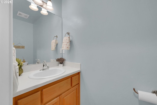 bathroom with vanity and visible vents