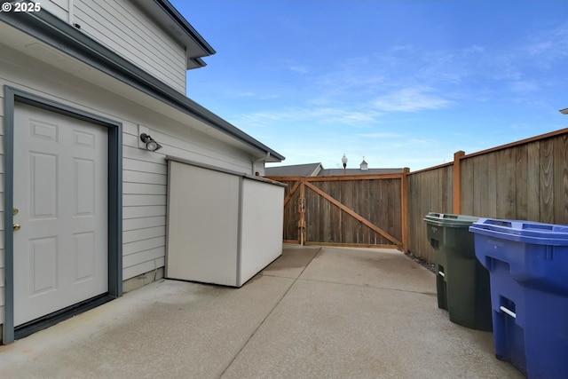 view of patio / terrace featuring a gate and fence