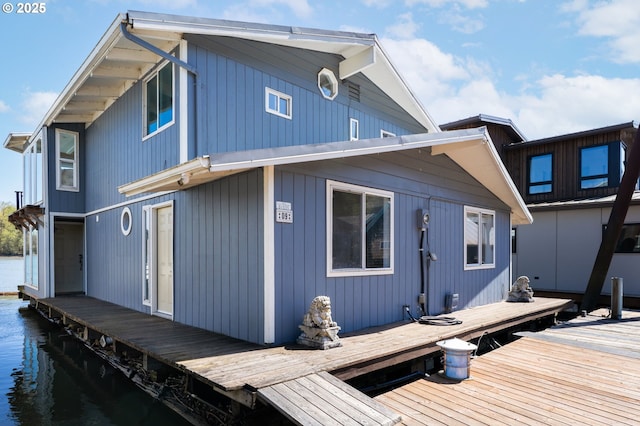rear view of house with a water view
