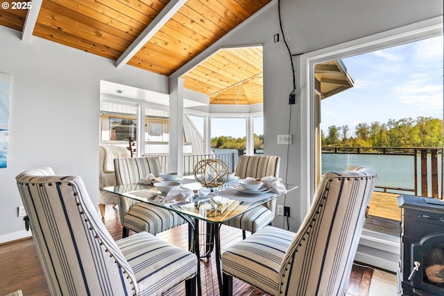 living area with wood ceiling, vaulted ceiling with beams, a ceiling fan, and dark wood-style flooring