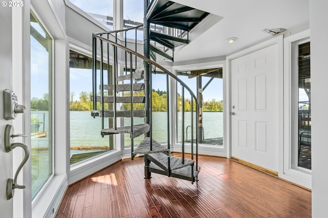 view of dock with a water view and a balcony