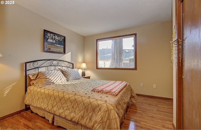 bedroom with light wood-type flooring