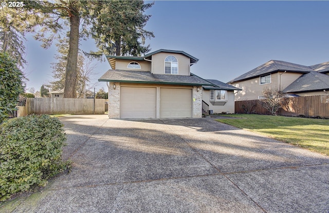 view of front of house with a garage and a front yard