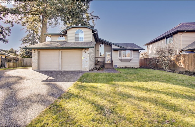 view of front facade featuring a garage and a front lawn