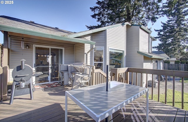 wooden deck with area for grilling