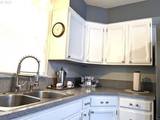 kitchen with sink and white cabinets