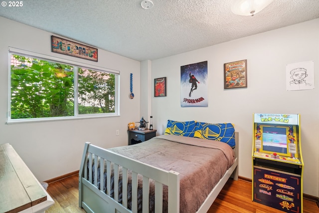 2818 Treetop Ln, West Linn, OR 97068 - bedroom featuring a textured ceiling, wood finished floors, and baseboards