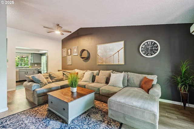 2818 Treetop Ln, West Linn, OR 97068 - living area with wood finished floors, ceiling fan, lofted ceiling, and baseboards