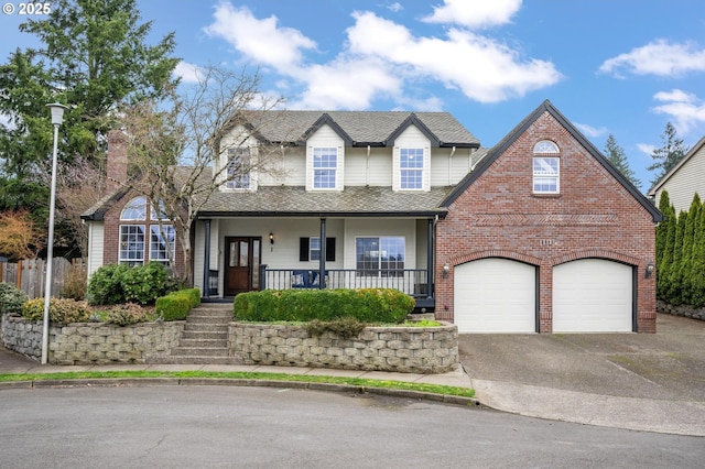 traditional-style home featuring driveway, roof with shingles, a porch, a garage, and brick siding