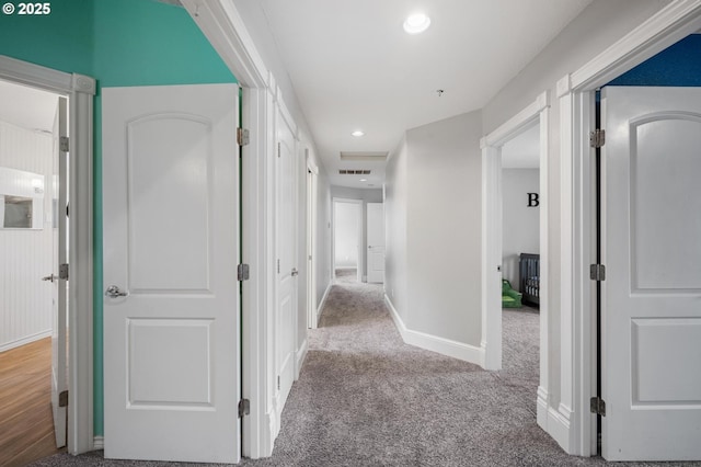 hall with baseboards, carpet flooring, recessed lighting, and visible vents