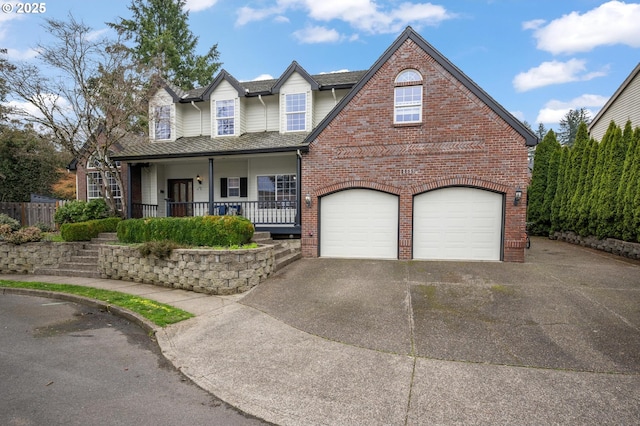 view of front facade with brick siding, a porch, concrete driveway, and a shingled roof