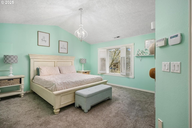 carpeted bedroom with baseboards, vaulted ceiling, a textured ceiling, and a chandelier