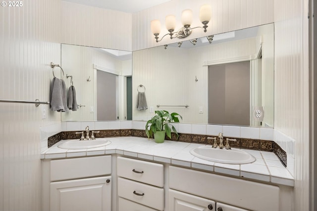 bathroom with double vanity and a sink