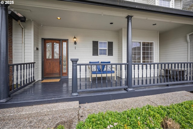 entrance to property featuring a porch