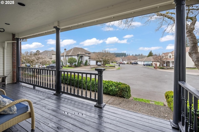 wooden deck featuring a residential view