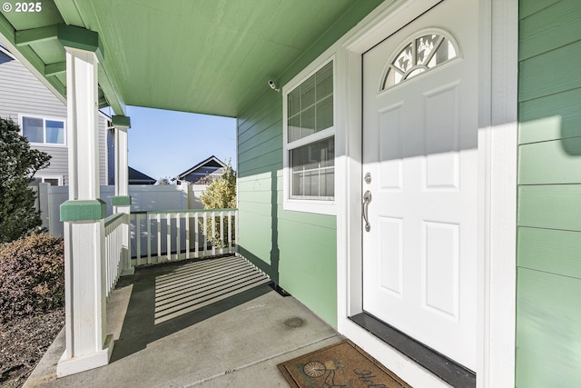 entrance to property featuring covered porch