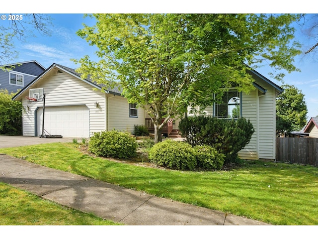 view of front of property with a garage, a front lawn, fence, and driveway