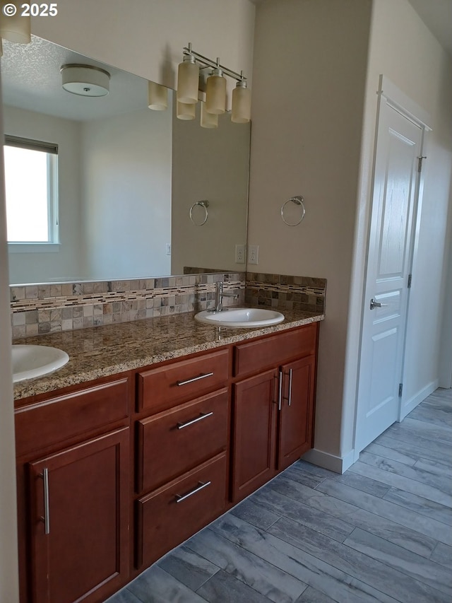 3625 Snowberry Rd, Eugene, OR 97403 - full bathroom featuring double vanity, wood finished floors, and decorative backsplash
