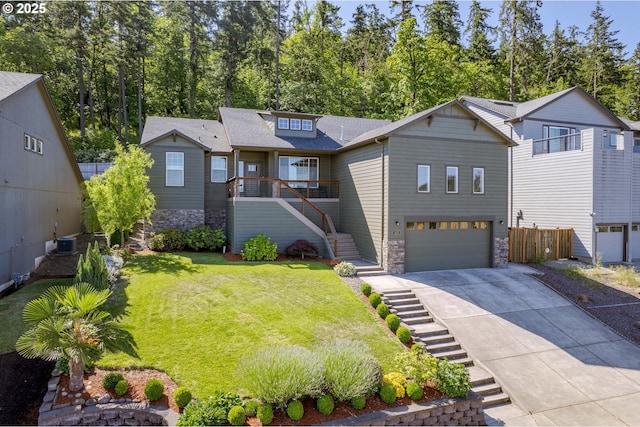 3625 Snowberry Rd, Eugene, OR 97403 - view of front facade with stairs, a garage, driveway, stone siding, and a front lawn