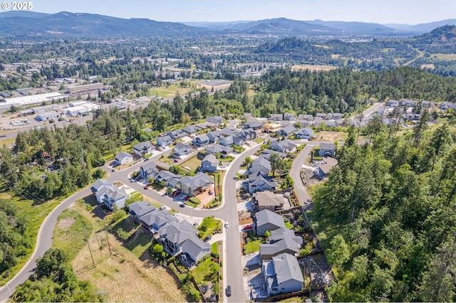 3625 Snowberry Rd, Eugene, OR 97403 - aerial view of property and surrounding area featuring a mountainous background and nearby suburban area
