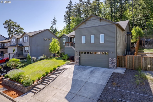 3625 Snowberry Rd, Eugene, OR 97403 - view of front of home featuring a garage, stone siding, concrete driveway, and a residential view