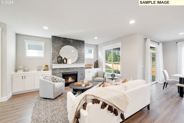 9129 S 3rd St Unit 114, Ridgefield, WA 98642 - living area featuring light wood finished floors, healthy amount of natural light, a fireplace, and recessed lighting