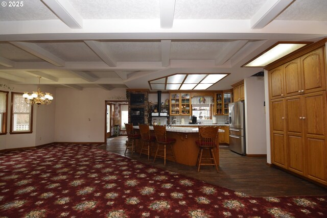 1397 State Route 506, Vader, WA 98593 - kitchen with stainless steel refrigerator with ice dispenser, a chandelier, a breakfast bar, glass insert cabinets, and brown cabinetry
