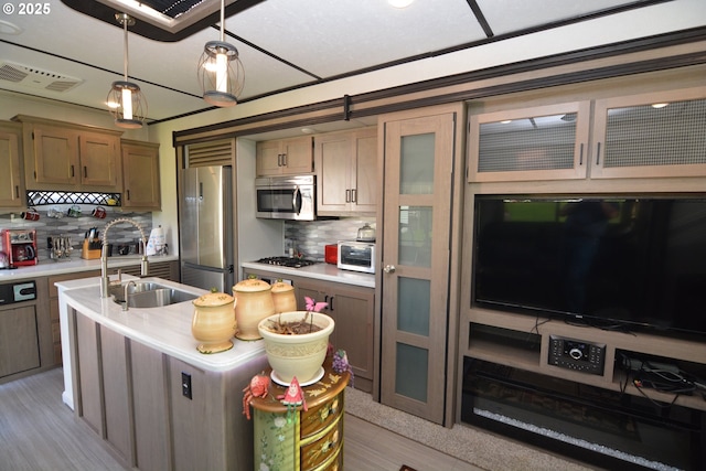 1397 State Route 506, Vader, WA 98593 - kitchen with appliances with stainless steel finishes, light countertops, tasteful backsplash, and hanging light fixtures