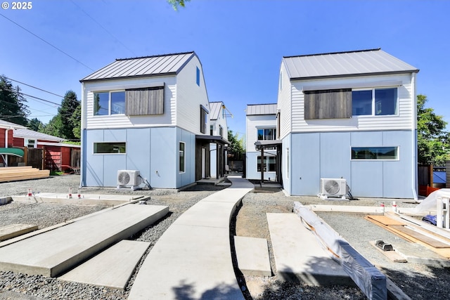 45 W 27th Ave Unit B, Eugene, OR 97405 - modern home with ac unit, metal roof, and a standing seam roof