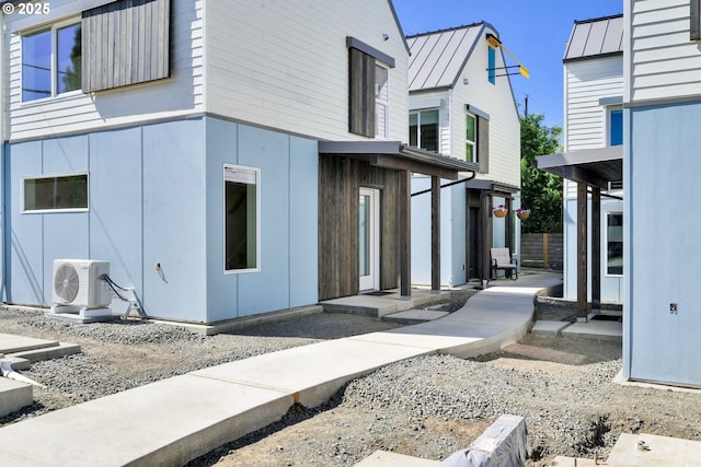 45 W 27th Ave Unit B, Eugene, OR 97405 - view of property exterior with a cooling unit, a standing seam roof, and metal roof