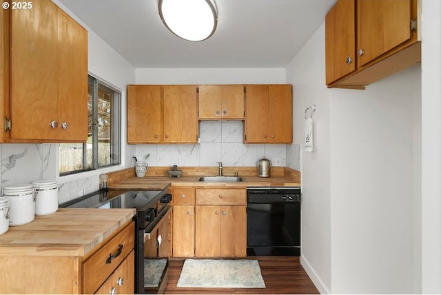 kitchen with sink, dark wood-type flooring, backsplash, and black appliances