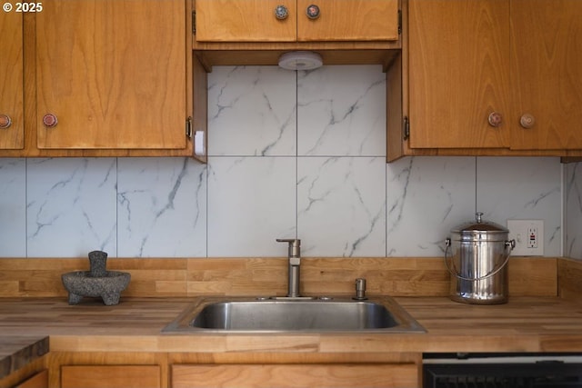 kitchen with tasteful backsplash, sink, and beverage cooler