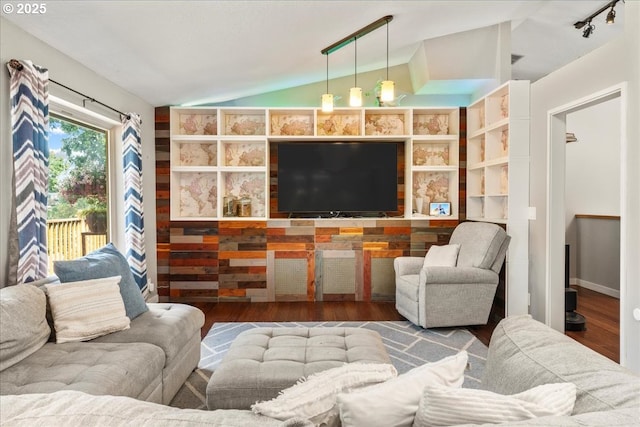 living room featuring vaulted ceiling and wood finished floors