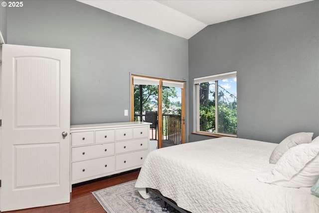 bedroom featuring access to outside, dark wood-style flooring, and high vaulted ceiling