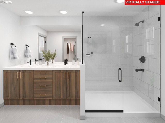 247 NW 29th Way, Battle Ground, WA 98604 - full bath with double vanity, a shower stall, recessed lighting, and baseboards