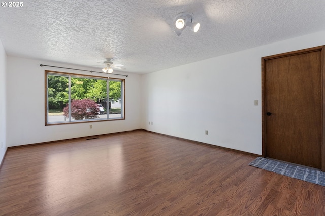 15605 SE 5th St, Vancouver, WA 98684 - empty room with wood finished floors, a ceiling fan, and a textured ceiling