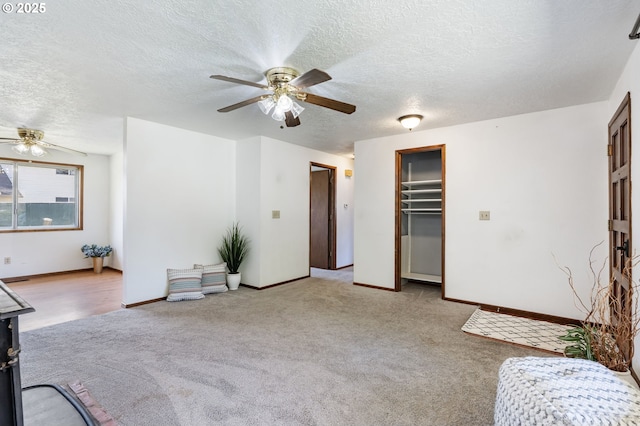 15605 SE 5th St, Vancouver, WA 98684 - unfurnished living room with a ceiling fan, carpet flooring, and a textured ceiling
