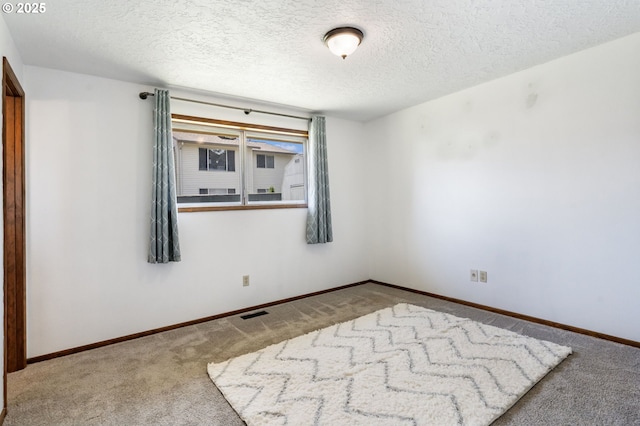 15605 SE 5th St, Vancouver, WA 98684 - carpeted spare room featuring a textured ceiling and baseboards
