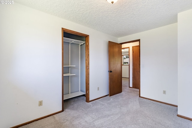 15605 SE 5th St, Vancouver, WA 98684 - unfurnished bedroom with carpet flooring, a textured ceiling, a walk in closet, and a closet