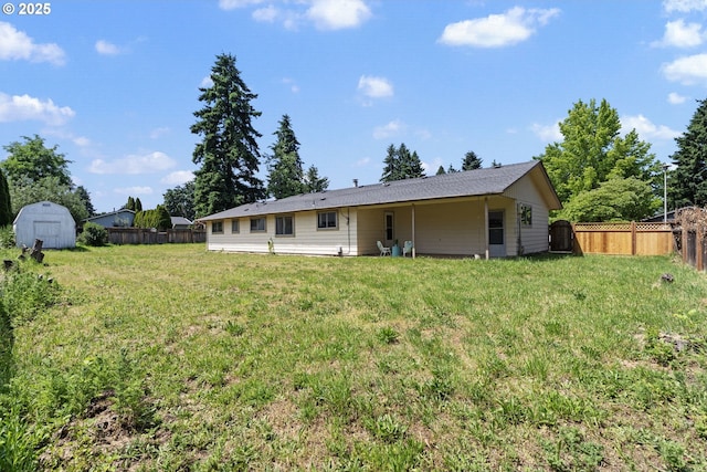 15605 SE 5th St, Vancouver, WA 98684 - back of house featuring a storage shed and a fenced backyard