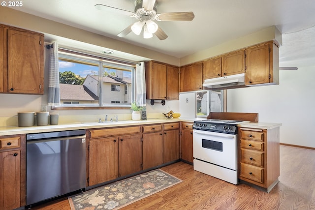 15605 SE 5th St, Vancouver, WA 98684 - kitchen with stainless steel dishwasher, white range with electric stovetop, under cabinet range hood, and ceiling fan