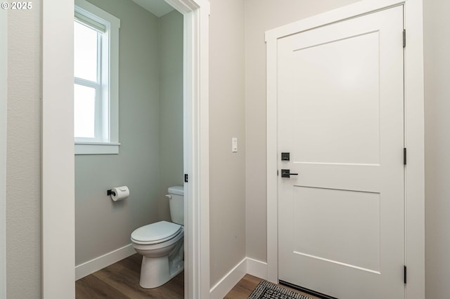 4027 SW Myrtle Aly Unit 7, Gresham, OR 97030 - bathroom with wood finished floors, a wealth of natural light, toilet, and baseboards