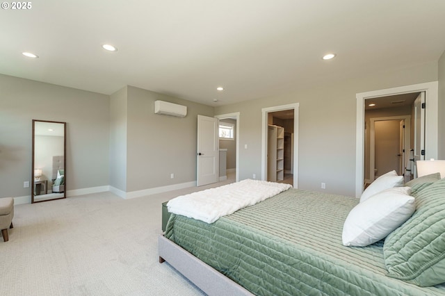 4027 SW Myrtle Aly Unit 7, Gresham, OR 97030 - bedroom with recessed lighting, a walk in closet, an AC wall unit, and light carpet