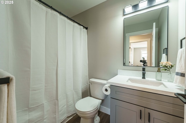 4027 SW Myrtle Aly Unit 7, Gresham, OR 97030 - bathroom with wood finished floors, vanity, and toilet