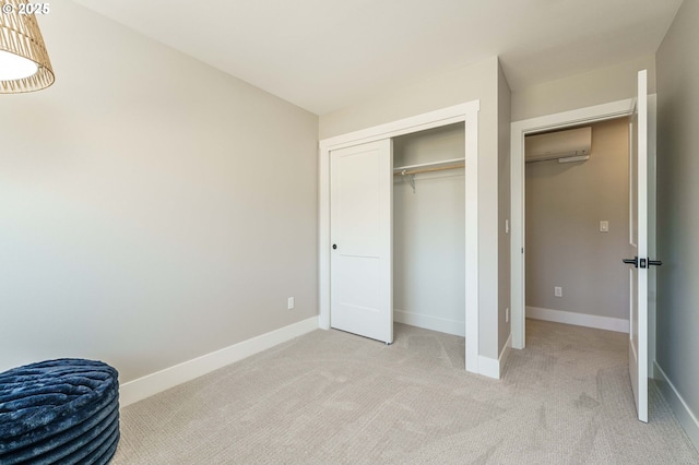 4027 SW Myrtle Aly Unit 7, Gresham, OR 97030 - bedroom with light carpet, baseboards, an AC wall unit, and a closet