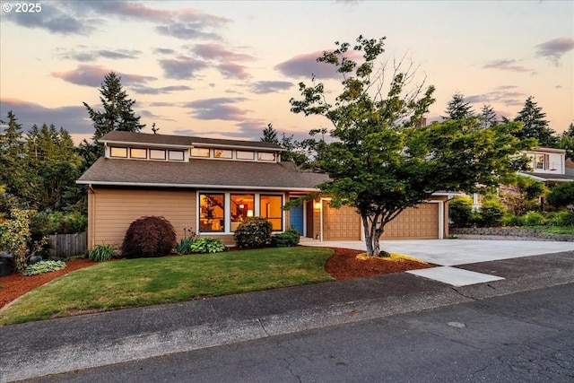 6567 Palomino Way W, Linn, OR 97068 - view of front facade with concrete driveway, an attached garage, and a shingled roof