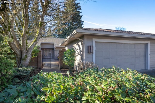 ranch-style home featuring a garage