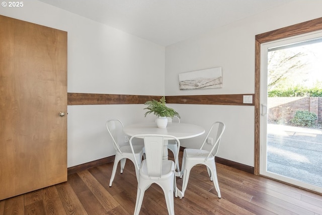 dining area with hardwood / wood-style flooring