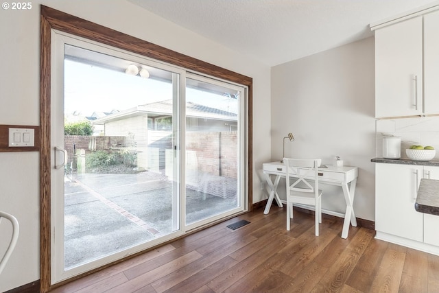 dining area with hardwood / wood-style flooring